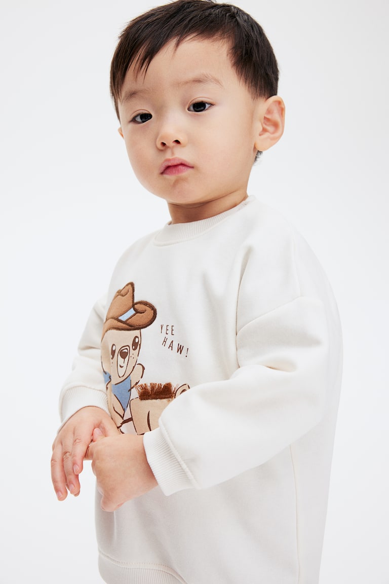 H&M Sweatshirt mit Motiv Super Rabatt