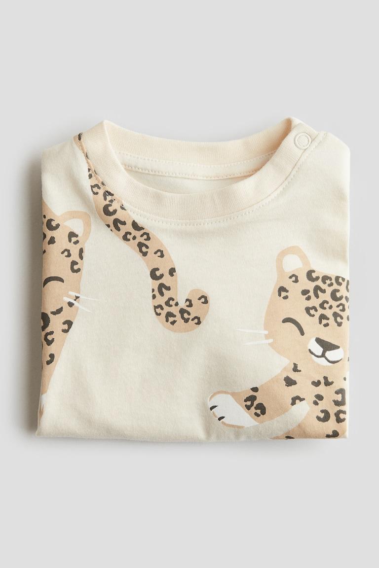 H&M Baumwoll-T-Shirt mit Print Rabatte dieses Monats